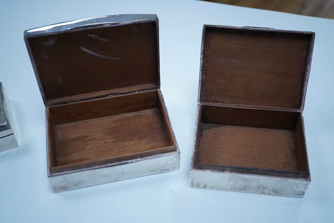 Three assorted George V/George VI silver mounted cigarette boxes, including two with engine tuned covers, the largest by Joseph Gloster Ltd, Birmingham, 1946, 12.8cm.